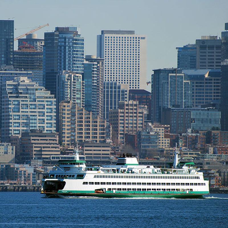 Washington State ferry passes in front of Seattle skyline