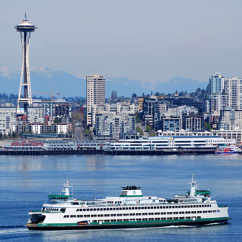 Washington State ferry passes in front of Seattle Space Needle